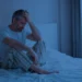 Man with insomnia awake at night because of frequent urination at night — visual representation of nocturia and prostate health issues.